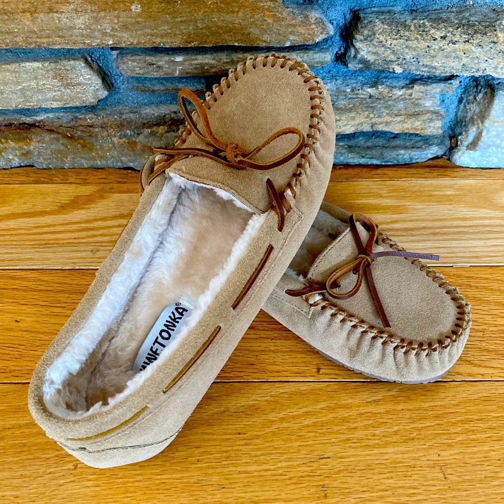 Woman’s Minnetonka house slippers.